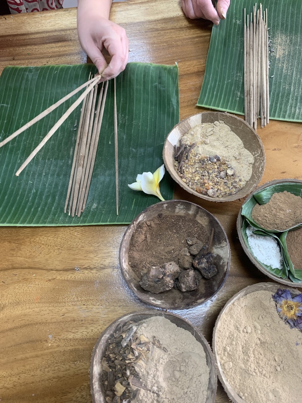 Sacred Smoke incense workshop table with raw botanicals in Ubud