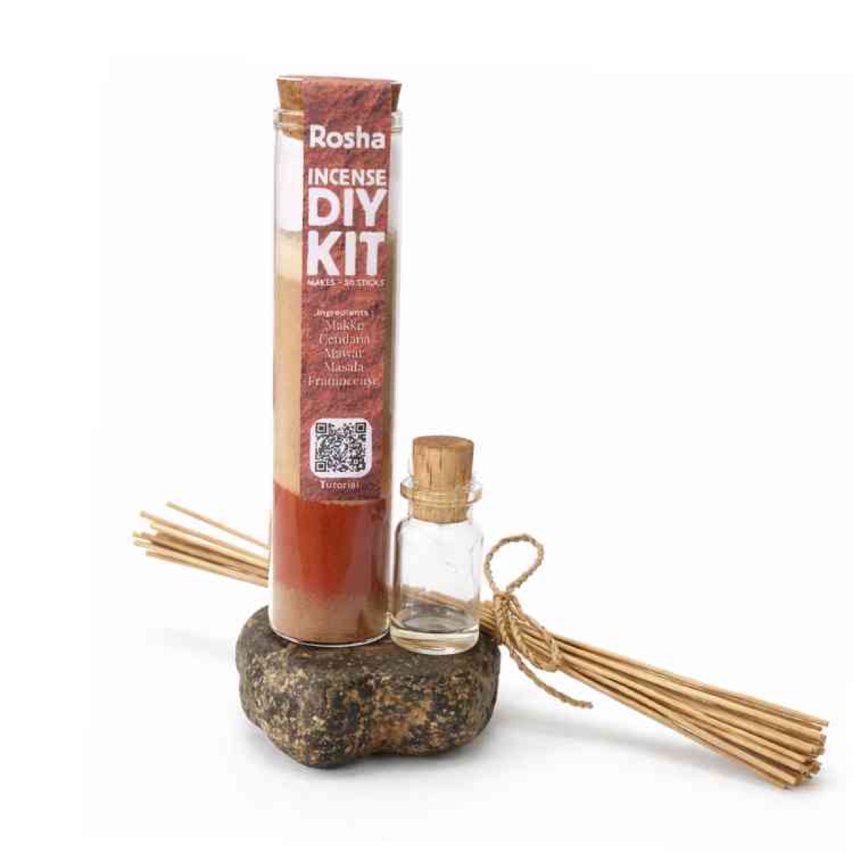 Rosha kit tube, oil vial, and incense sticks on white