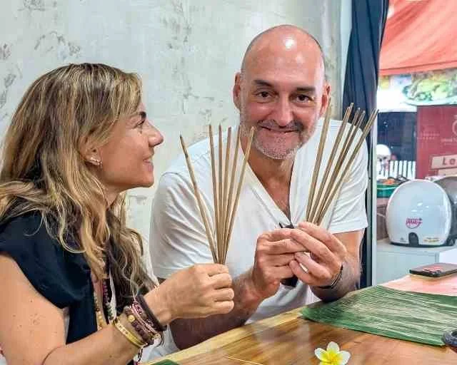 Guests smiling with handmade incense sticks